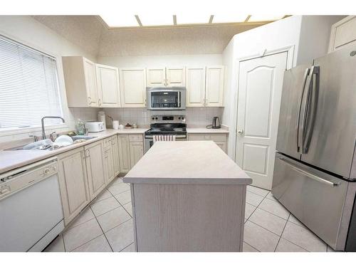 6122 98 Street, Grande Prairie, AB - Indoor Photo Showing Kitchen With Double Sink