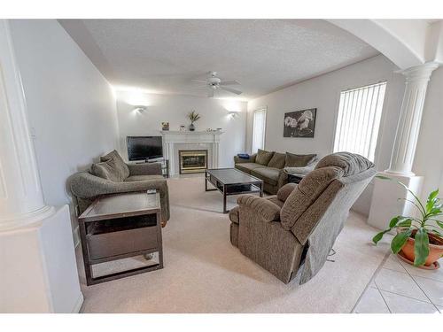 6122 98 Street, Grande Prairie, AB - Indoor Photo Showing Living Room With Fireplace