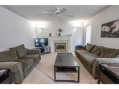 6122 98 Street, Grande Prairie, AB - Indoor Photo Showing Living Room With Fireplace