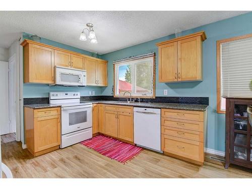 9851 80 Avenue, Grande Prairie, AB - Indoor Photo Showing Kitchen With Double Sink