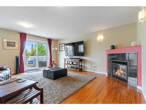 10938 60 Avenue, Grande Prairie, AB - Indoor Photo Showing Living Room With Fireplace