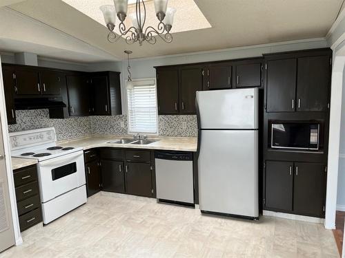 20 Des Compagnon Avenue, St. Isidore, AB - Indoor Photo Showing Kitchen With Double Sink