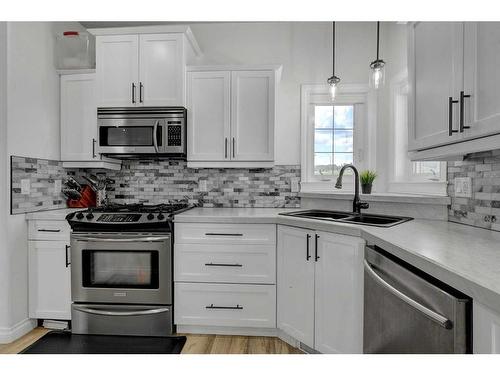 58 Sunset Drive, Spirit River, AB - Indoor Photo Showing Kitchen With Double Sink With Upgraded Kitchen