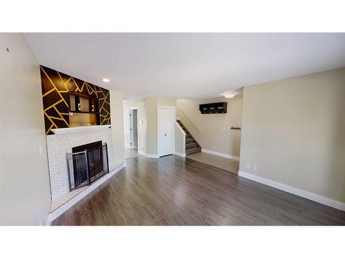 8911 62 Avenue, Grande Prairie, AB - Indoor Photo Showing Other Room With Fireplace