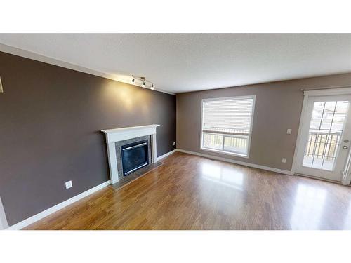 10306 70 Avenue, Grande Prairie, AB - Indoor Photo Showing Living Room With Fireplace