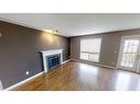 10306 70 Avenue, Grande Prairie, AB  - Indoor Photo Showing Living Room With Fireplace 