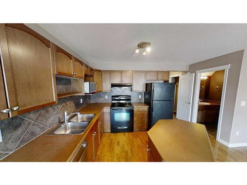 10306 70 Avenue, Grande Prairie, AB - Indoor Photo Showing Kitchen With Double Sink