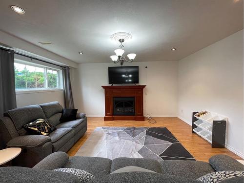 4412 56 Avenue, High Prairie, AB - Indoor Photo Showing Living Room With Fireplace