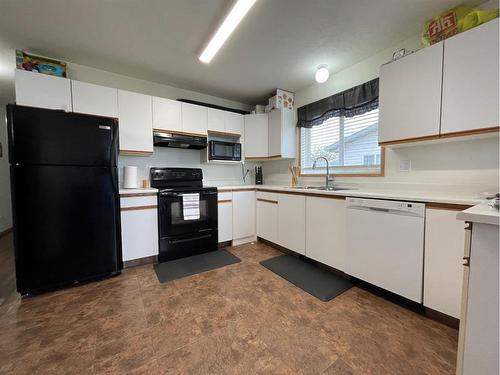 4412 56 Avenue, High Prairie, AB - Indoor Photo Showing Kitchen With Double Sink