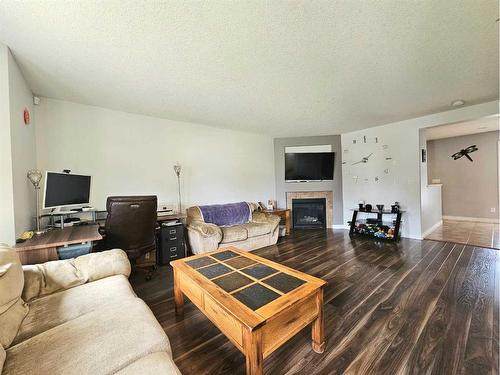 7026 112 Street South, Grande Prairie, AB - Indoor Photo Showing Living Room With Fireplace