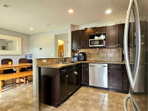 7026 112 Street South, Grande Prairie, AB - Indoor Photo Showing Kitchen With Double Sink