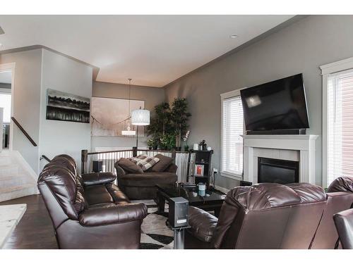 10569 113 Street, Grande Prairie, AB - Indoor Photo Showing Living Room With Fireplace