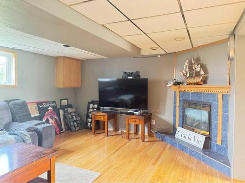 11414 Norris Crescent, Grande Cache, AB - Indoor Photo Showing Living Room With Fireplace