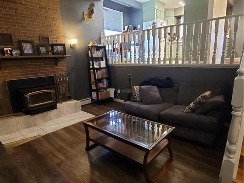 5405 52 Street, Berwyn, AB - Indoor Photo Showing Living Room With Fireplace