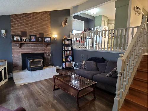 5405 52 Street, Berwyn, AB - Indoor Photo Showing Living Room With Fireplace