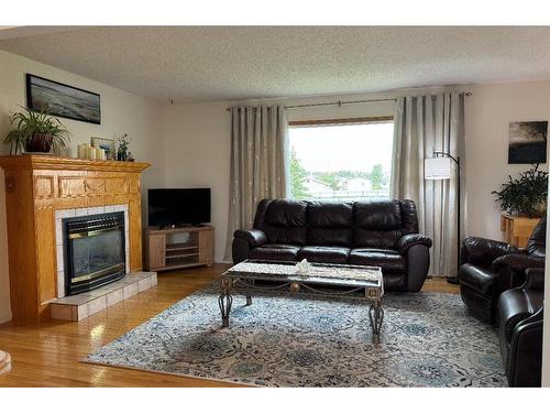 924 4 Avenue, Hines Creek, AB - Indoor Photo Showing Living Room With Fireplace