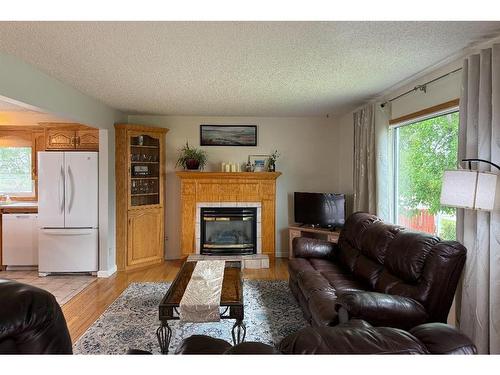 924 4 Avenue, Hines Creek, AB - Indoor Photo Showing Living Room With Fireplace