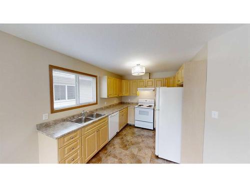 A/B-9917 109 Avenue, Grande Prairie, AB - Indoor Photo Showing Kitchen With Double Sink