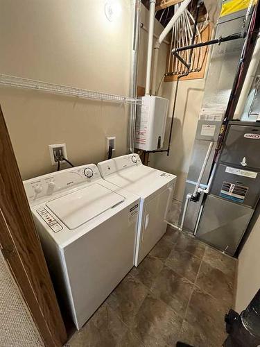 9901-9917 109 Avenue, Grande Prairie, AB - Indoor Photo Showing Laundry Room