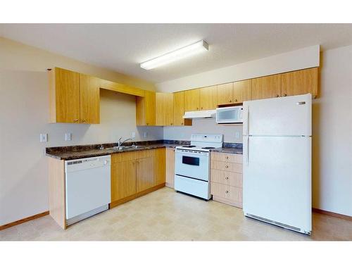 302-12015 Royal Oaks Drive, Grande Prairie, AB - Indoor Photo Showing Kitchen With Double Sink