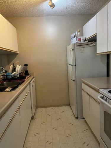 411-10405 99 Avenue, Grande Prairie, AB - Indoor Photo Showing Kitchen