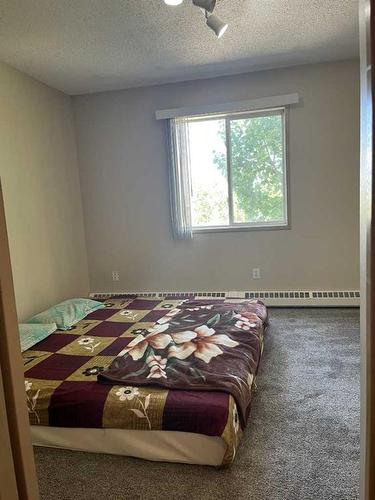 411-10405 99 Avenue, Grande Prairie, AB - Indoor Photo Showing Bedroom