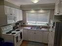 9607 85 Avenue, Peace River, AB  - Indoor Photo Showing Kitchen With Double Sink 