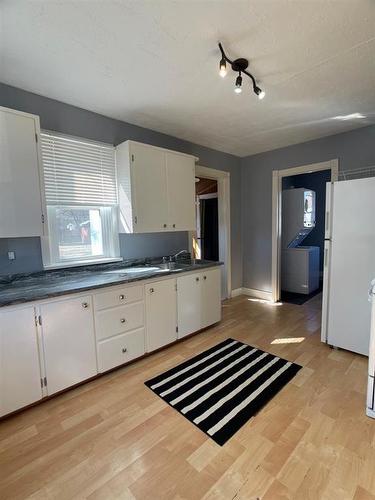 4409 52Nd Avenue, High Prairie, AB - Indoor Photo Showing Kitchen With Double Sink