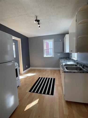 4409 52Nd Avenue, High Prairie, AB - Indoor Photo Showing Kitchen With Double Sink