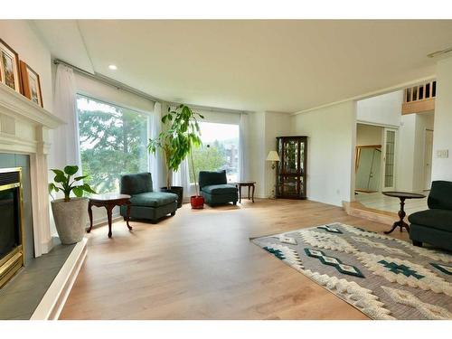 10010 89 Street, Peace River, AB - Indoor Photo Showing Living Room With Fireplace