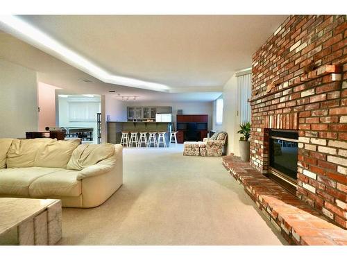 10010 89 Street, Peace River, AB - Indoor Photo Showing Living Room With Fireplace