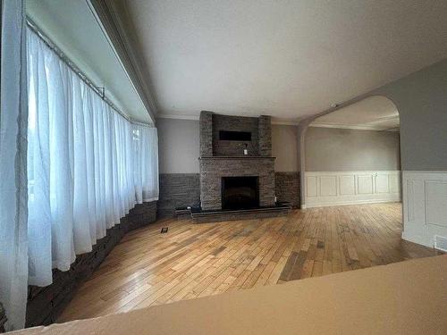 11305 101B Street, Grande Prairie, AB - Indoor Photo Showing Other Room With Fireplace