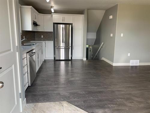 9709 113 Avenue, Clairmont, AB - Indoor Photo Showing Kitchen With Double Sink