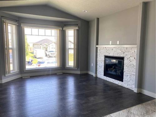 9709 113 Avenue, Clairmont, AB - Indoor Photo Showing Living Room With Fireplace