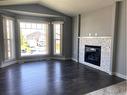 9709 113 Avenue, Clairmont, AB  - Indoor Photo Showing Living Room With Fireplace 