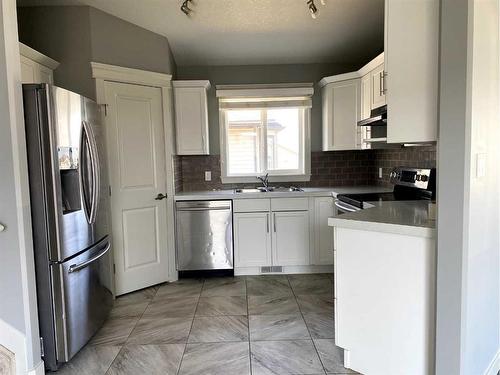 9709 113 Avenue, Clairmont, AB - Indoor Photo Showing Kitchen With Double Sink