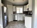 9709 113 Avenue, Clairmont, AB  - Indoor Photo Showing Kitchen With Double Sink 