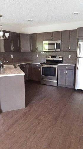 A & B-10217 106 Avenue, Grande Prairie, AB - Indoor Photo Showing Kitchen With Stainless Steel Kitchen With Upgraded Kitchen