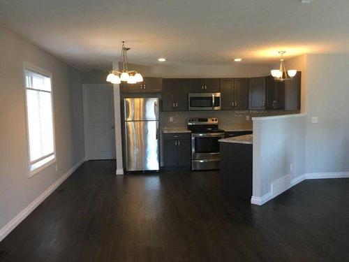 A & B-10217 106 Avenue, Grande Prairie, AB - Indoor Photo Showing Kitchen With Stainless Steel Kitchen