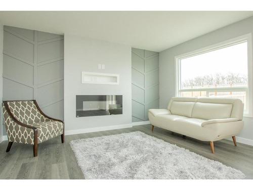 7802 91 Street, Grande Prairie, AB - Indoor Photo Showing Living Room With Fireplace