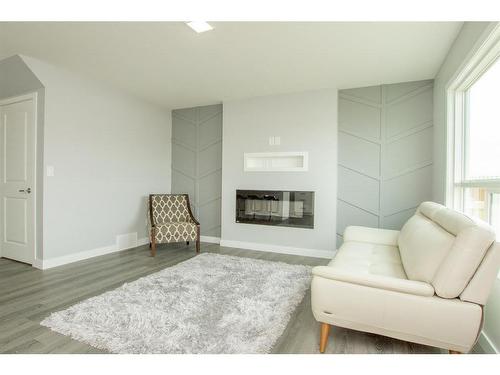 7802 91 Street, Grande Prairie, AB - Indoor Photo Showing Living Room With Fireplace