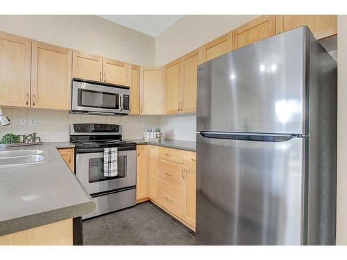 216-12320 102 Street, Grande Prairie, AB - Indoor Photo Showing Kitchen With Stainless Steel Kitchen