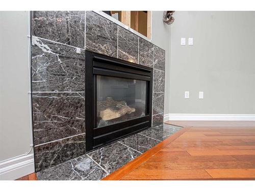 8802 89 Avenue, Grande Prairie, AB - Indoor Photo Showing Living Room With Fireplace