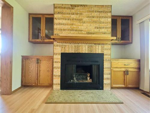 4805 Doyle Avenue, Donnelly, AB - Indoor Photo Showing Living Room With Fireplace