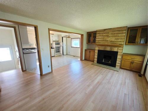 4805 Doyle Avenue, Donnelly, AB - Indoor Photo Showing Living Room With Fireplace