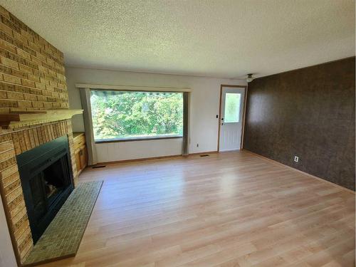 4805 Doyle Avenue, Donnelly, AB - Indoor Photo Showing Other Room With Fireplace