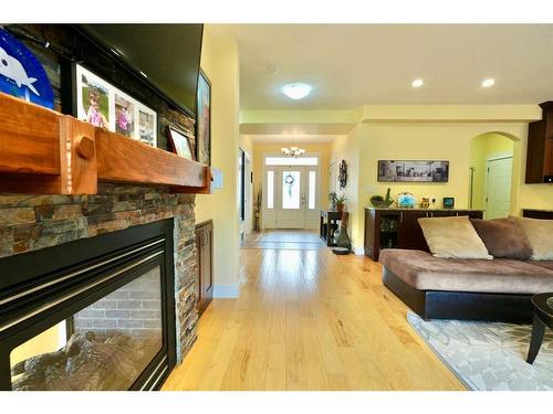 10313 86 Street, Peace River, AB - Indoor Photo Showing Living Room With Fireplace