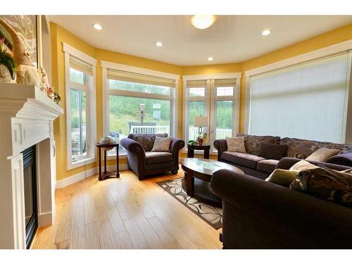 10313 86 Street, Peace River, AB - Indoor Photo Showing Living Room With Fireplace