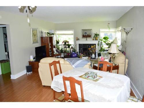 10115 105 Avenue, Peace River, AB - Indoor Photo Showing Dining Room With Fireplace