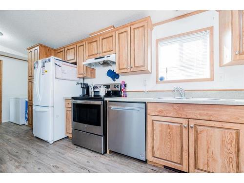 8601 90 Street, Grande Prairie, AB - Indoor Photo Showing Kitchen With Double Sink